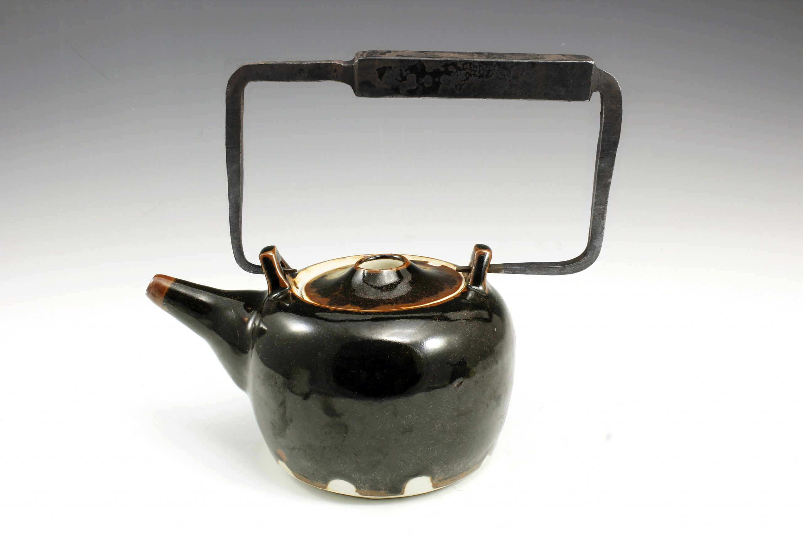 forged iron and ceramic teapot liza mitrofanova